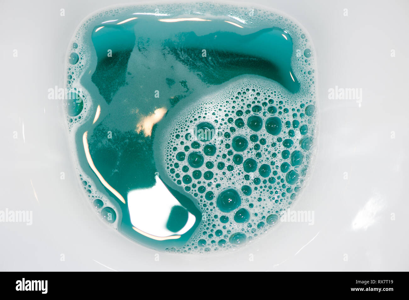 Close up of water in the toilet with bubbles Stock Photo Alamy