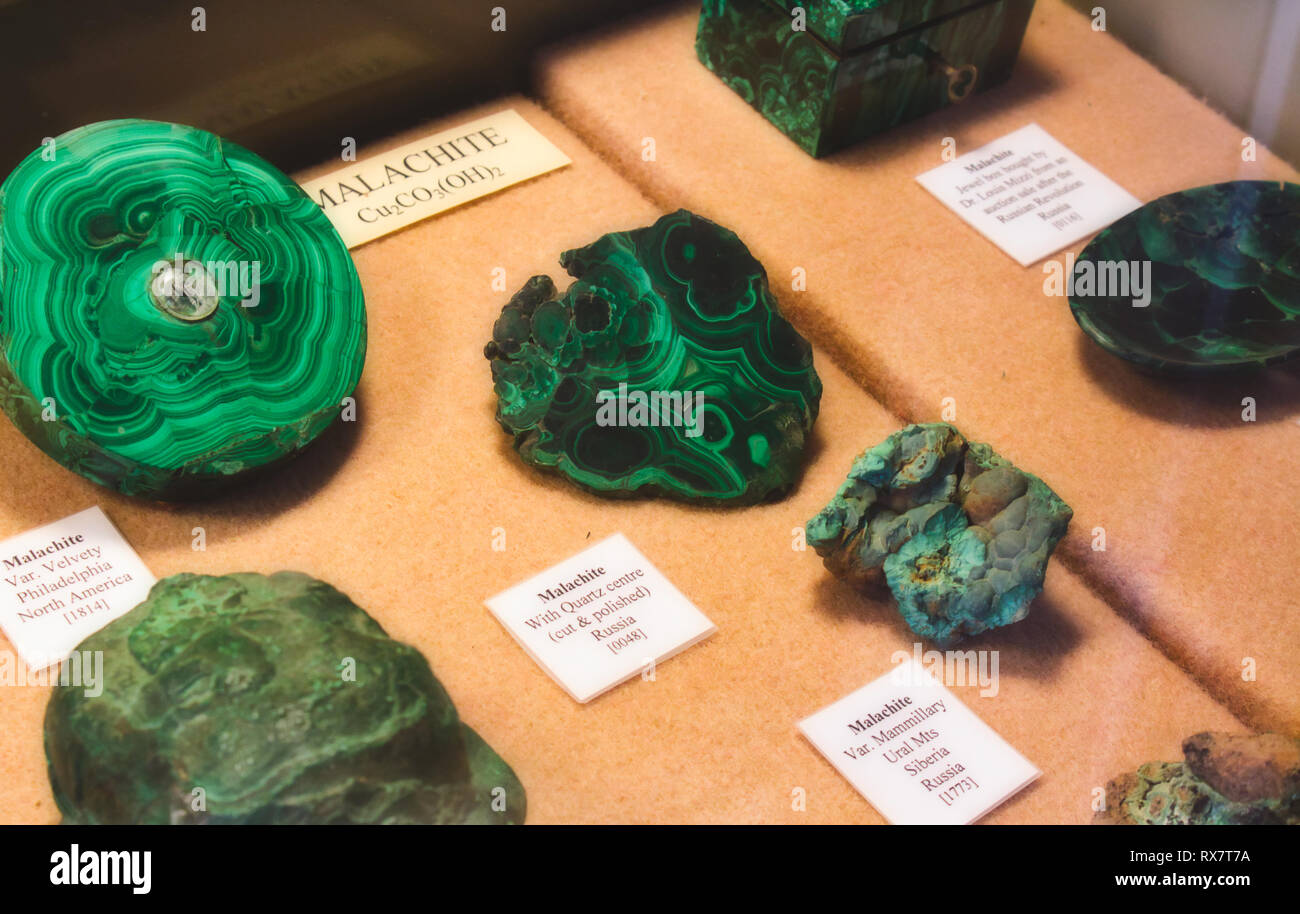 Rabat / Malta - November 25 2018: Collection of Malachite stones on display as part of a geological mineral exhibit Stock Photo