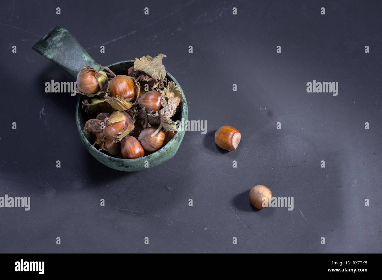 A handful of hazelnuts in a mug. Whole hazelnuts. Top. Stock Photo