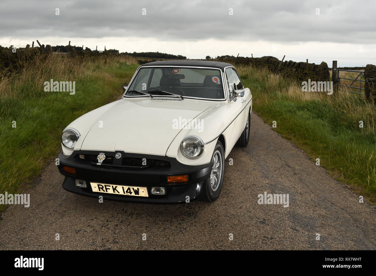 MGB GT British classic car standing on a country lane in the Peak