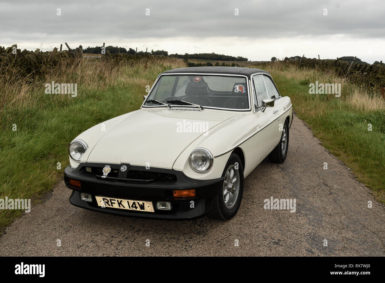 MGB GT British classic car standing on a country lane in the Peak