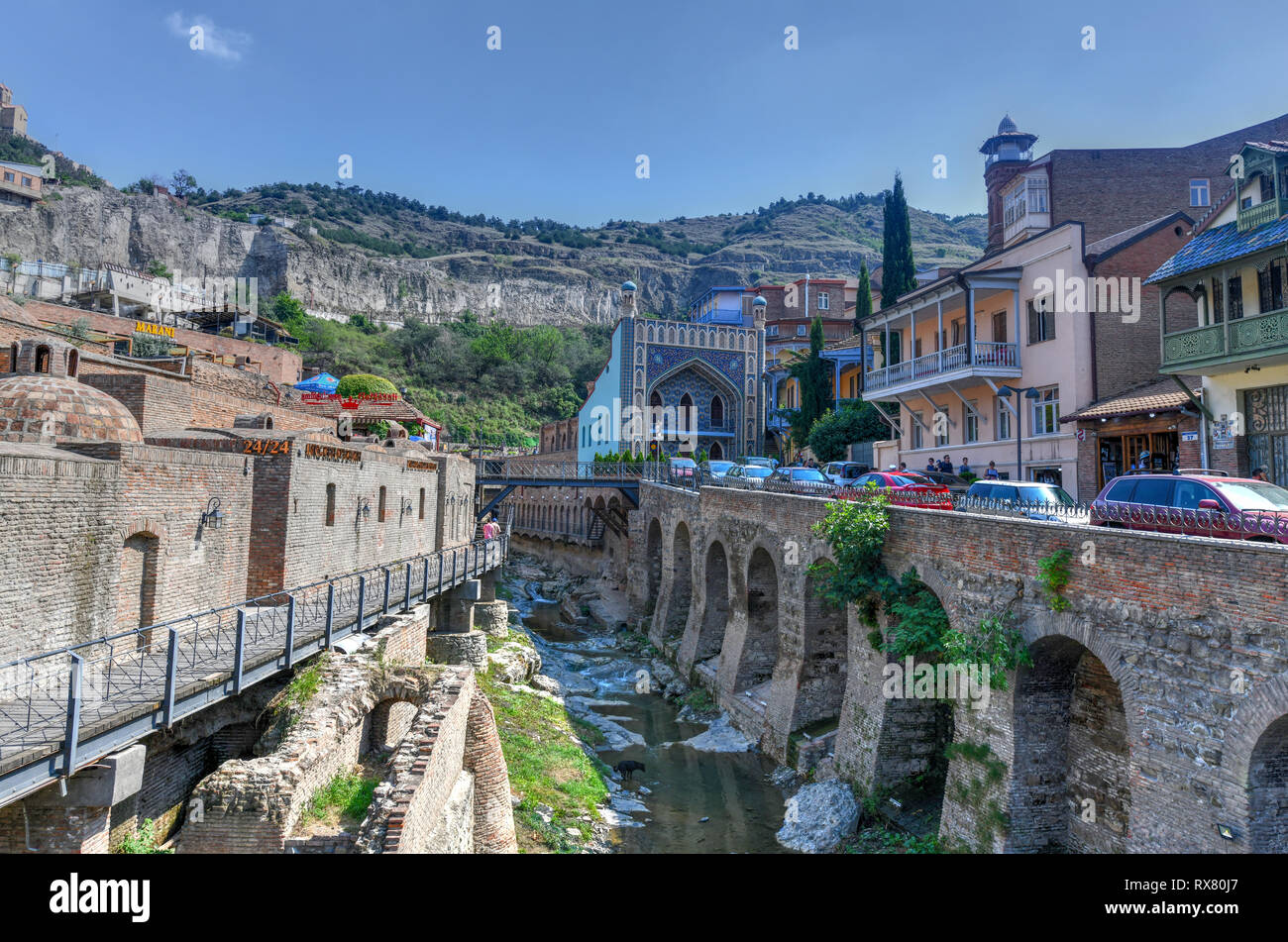 Tbilisi, Georgia - July 10, 2018: Famous sulphur baths with Orbeliani islamic mosque, traditional Tiflis architecture, carved wooden balconies at Aban Stock Photo