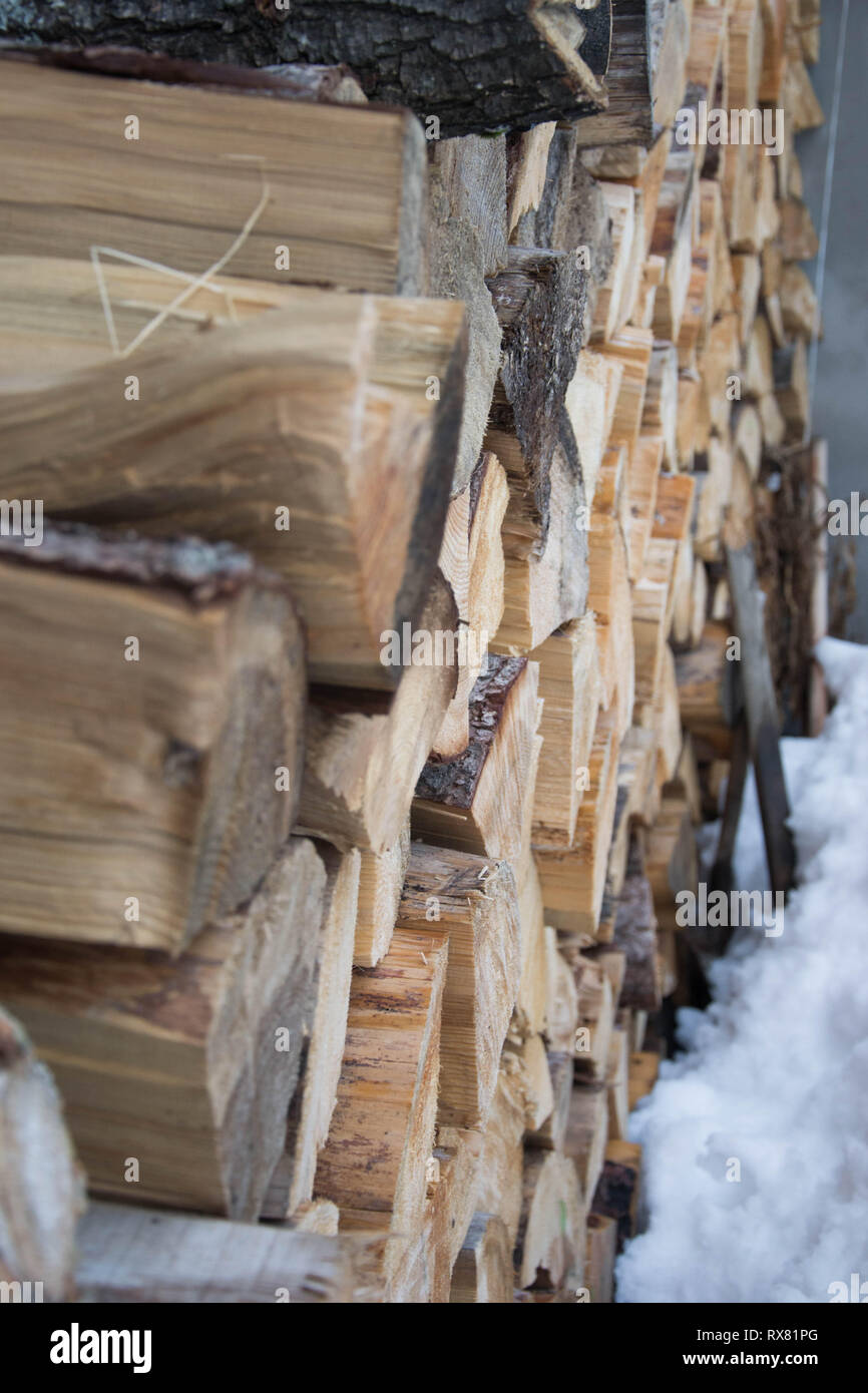 Sawn Logs Covered In Snow In Winter Season Outdoors Stacked