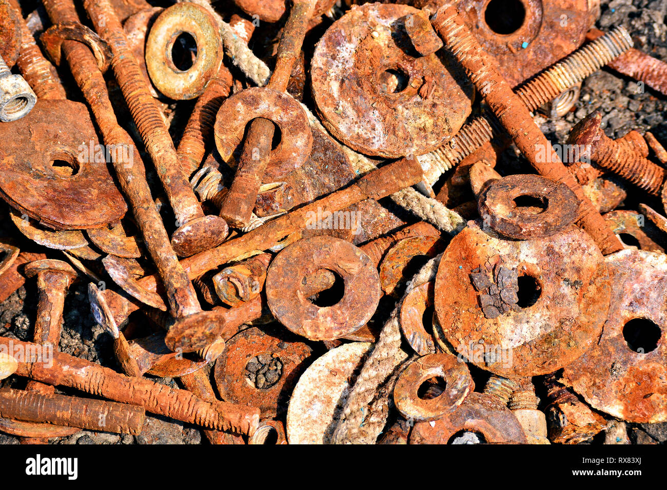 Rusted nuts and bolts left to corrode in a boatyard Stock Photo