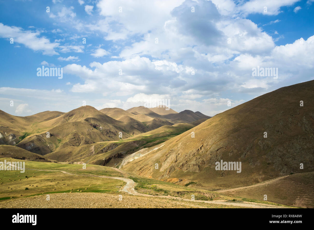Mountain landscape with blue sky and clouds Stock Photo - Alamy