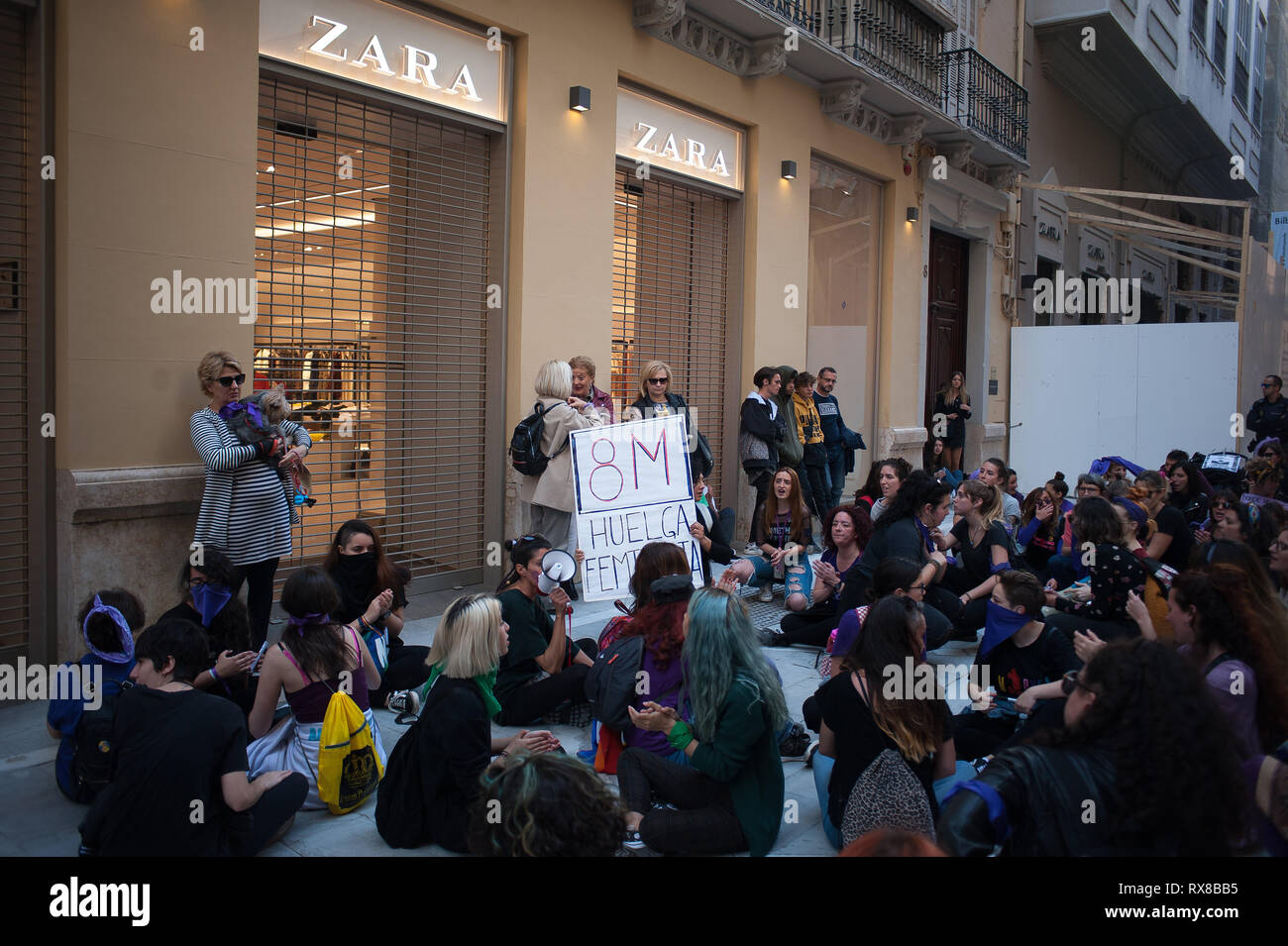 A group of picketers women are seen seated outside zara shop as they take  part during the 24-hours General Women's Strike. A 24-hour General Women's  Strike. Every 08 march coinciding with the