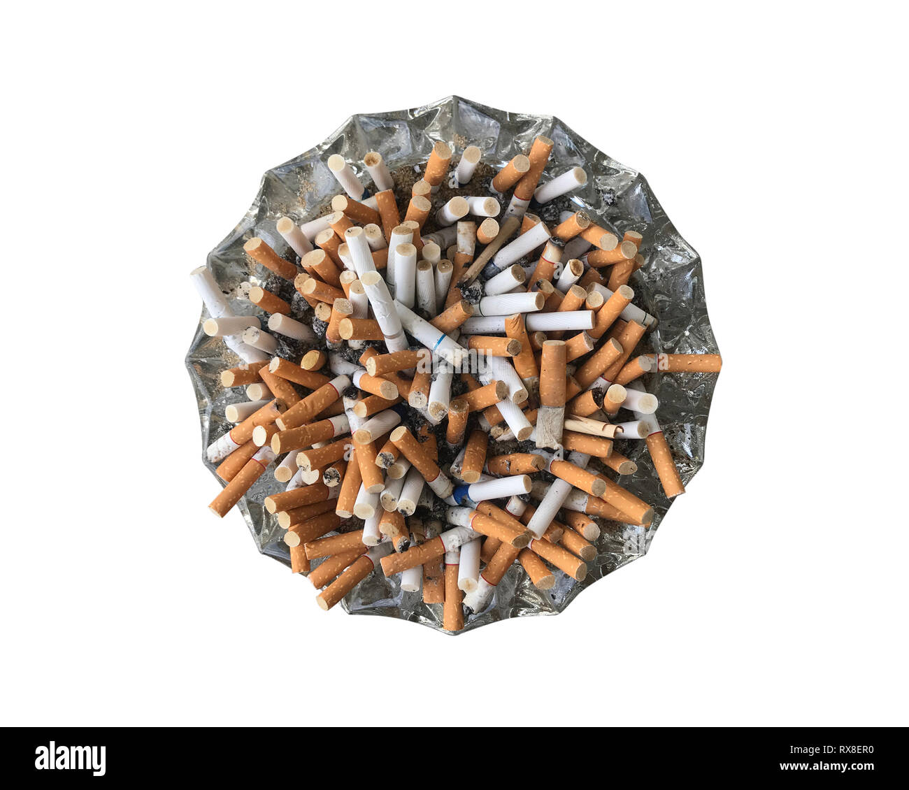 Many cigarette overflowing a glass ashtray isolated on white background ...