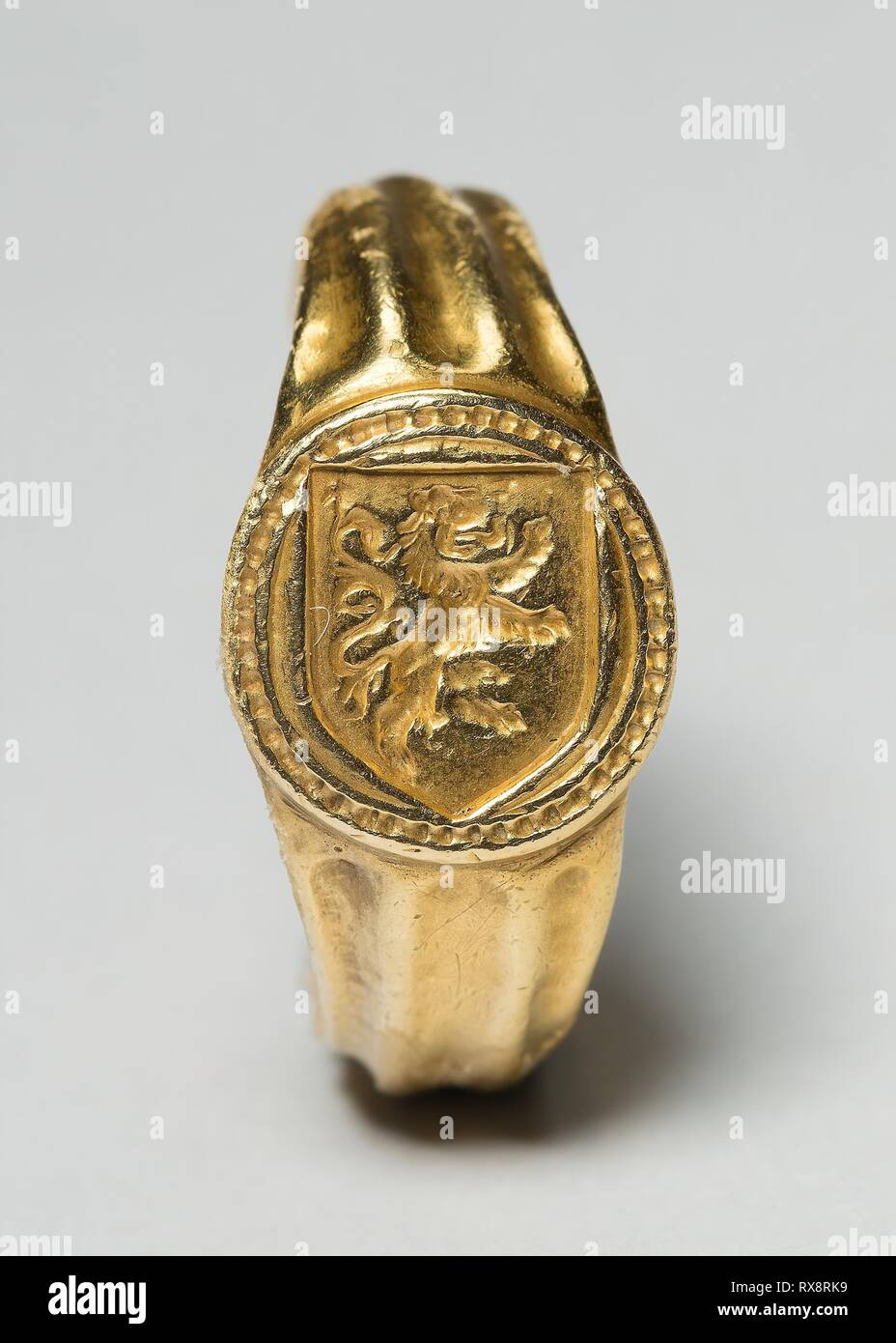 Signet Ring with a Rampant Lion. Netherlandish; probably Bruges. Date: 1475-1500. Dimensions: Circumference: 6.4 cm (2 1/2 in.); Diameter: 2 cm (3/4 in.). Gold. Origin: Bruges. Museum: The Chicago Art Institute. Stock Photo
