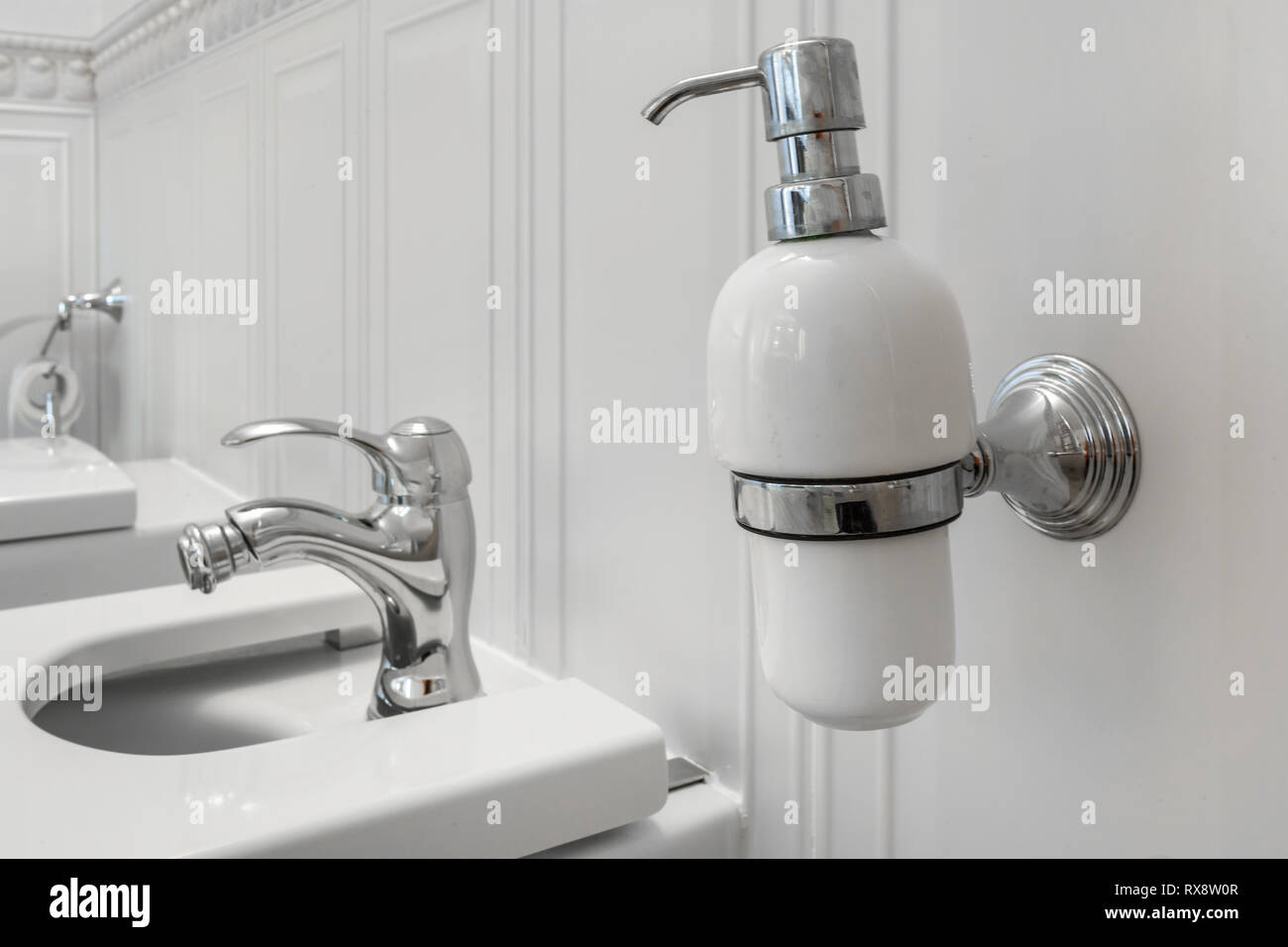 toilet and detail of a corner shower bidet with soap and shampoo