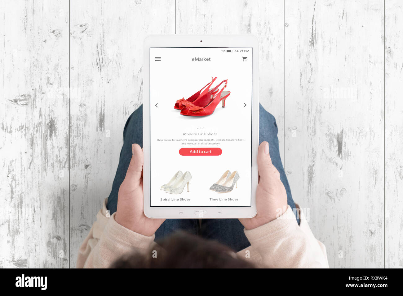 Tablet in woman hands with shopping ecommerce app with modern flat interface on display. Stock Photo