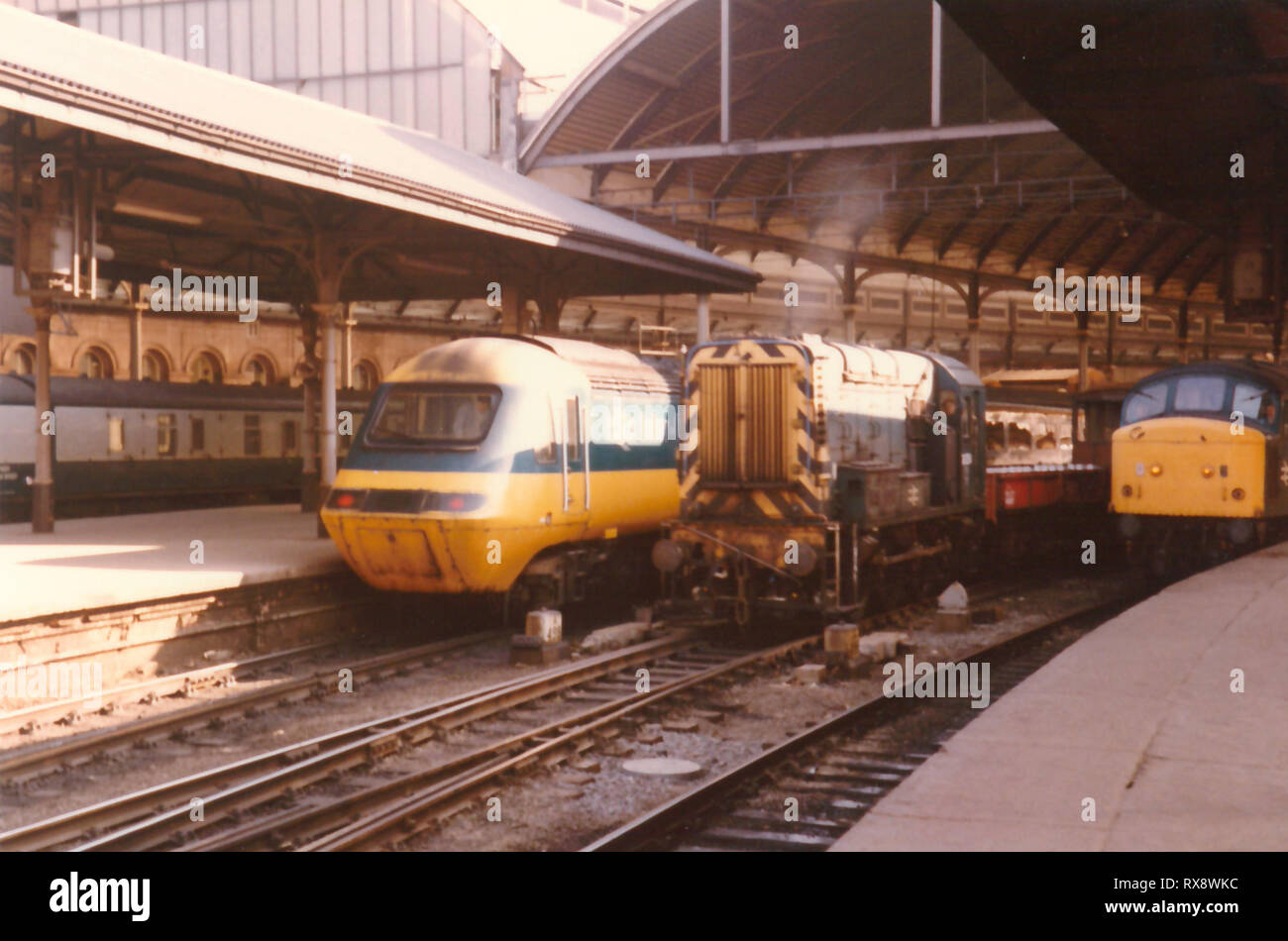 High Speed Train sits at Newcastle Central Station alongside a Class 08 in the centre road and a Class 46 on the opposite platform in the 1980s. Stock Photo