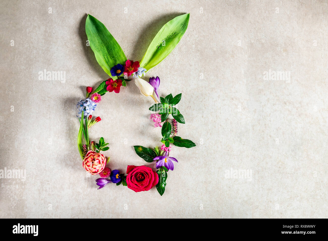 Easter minimal concept. Egg shape with bunny ears made from spring ...