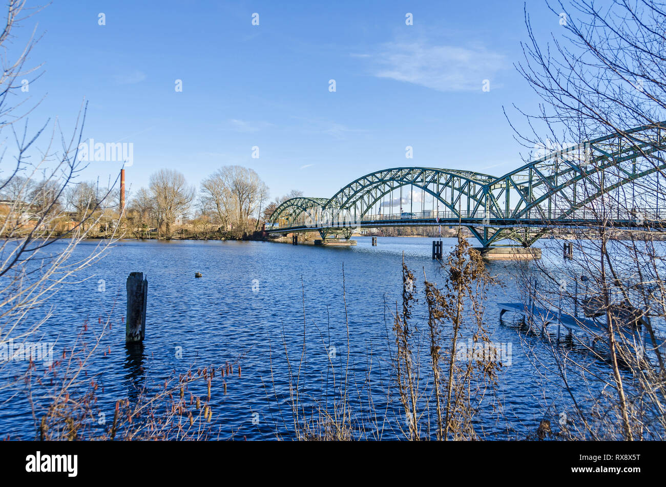 Steel arch bridge Eiswerderbruecke over the river Havel and the Island Eiswerder as seen from the street An Der Wasserstadt Stock Photo