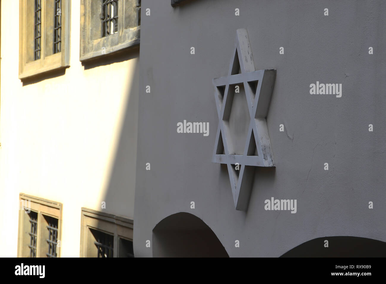 Star of David on the facade of a synagogue in Prague Stock Photo