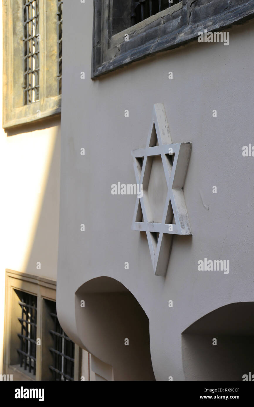 Star of David on the facade of a synagogue in Prague Stock Photo