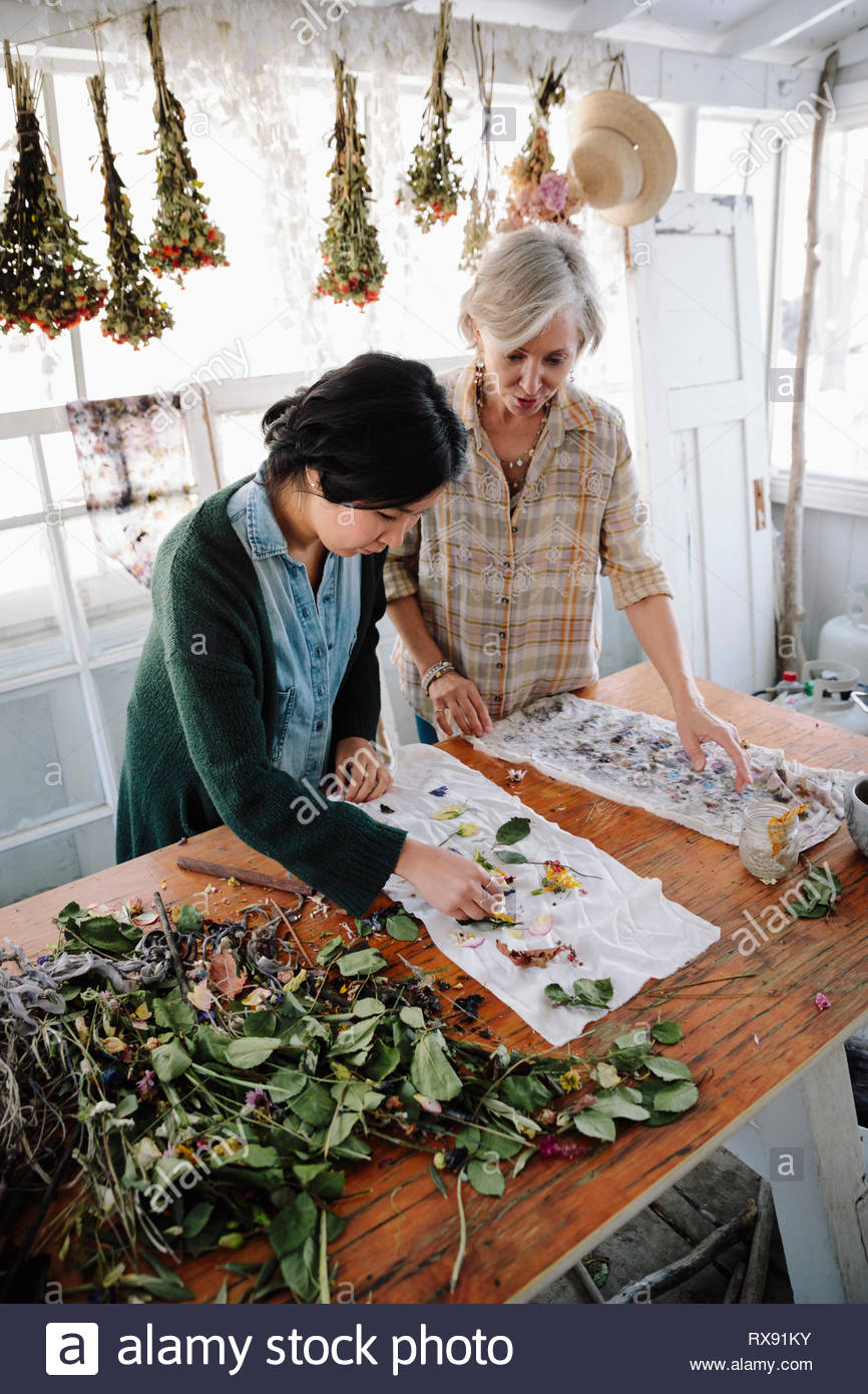Women drying flowers for paper making Stock Photo Alamy