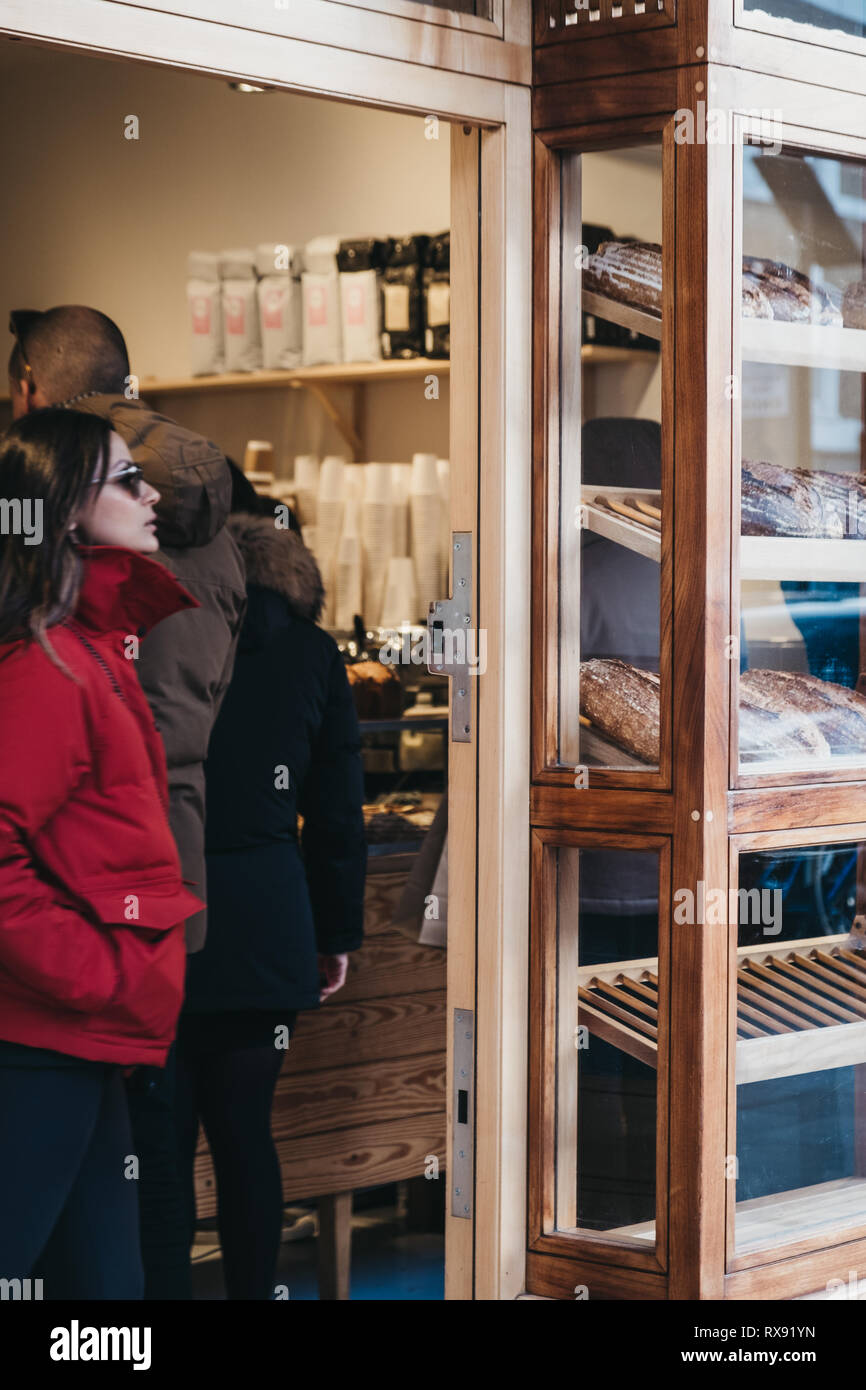 London, UK - February 03, 2019: People by the window display of Pavilion bakery on Broadway Market, a shopping street in the heart of Hackney, East Lo Stock Photo