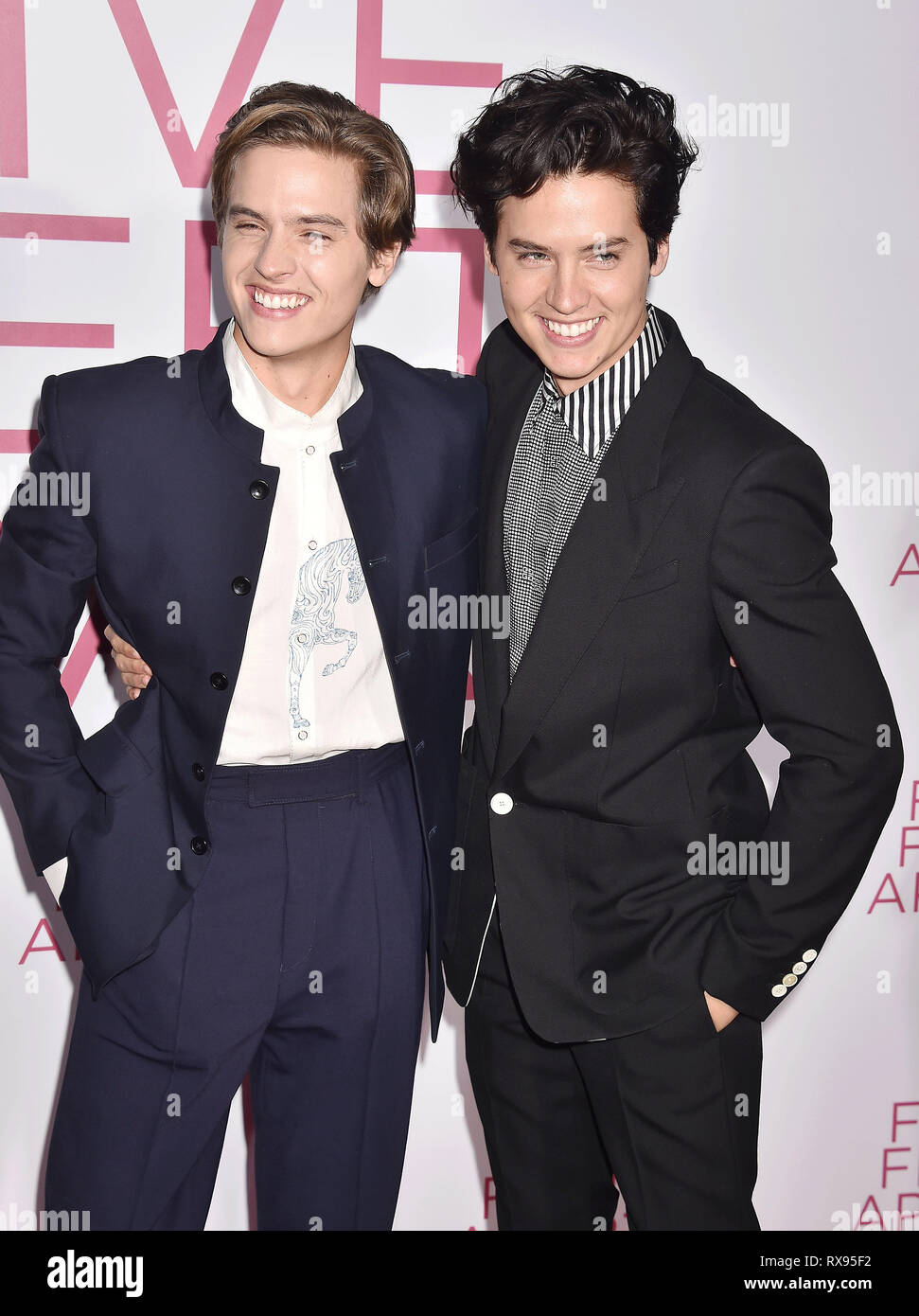 WESTWOOD, CA - MARCH 07: Dylan Spouse (L) and Cole Sprouse attend the Premiere Of Lionsgate's 'Five Feet Apart' at Fox Bruin Theatre on March 07, 2019 Stock Photo