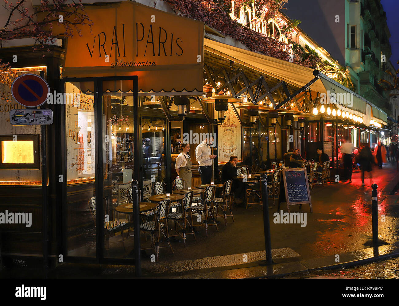 The Cafe Vrai Pars at rainy evening.It is a cafe in the Montmartre, Paris, France. Stock Photo