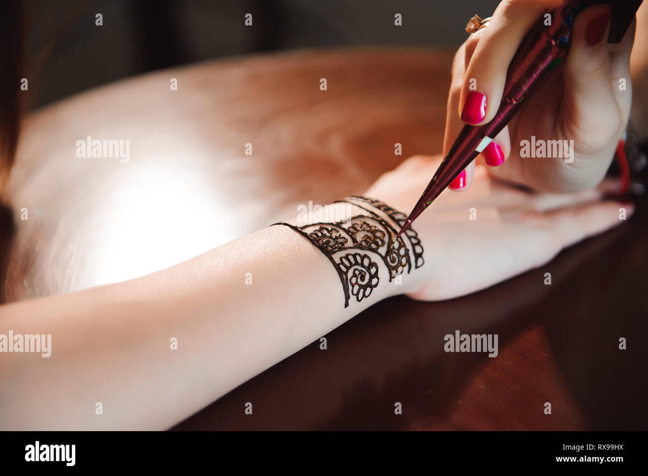 Artist Applying Henna Tattoo On Women Hands Mehndi Is Traditional Indian Decorative Art Stock Photo Alamy Artist Applying Henna Tattoo On Women Hands Mehndi Is Traditional Indian Decorative Art Stock Photo Alamy