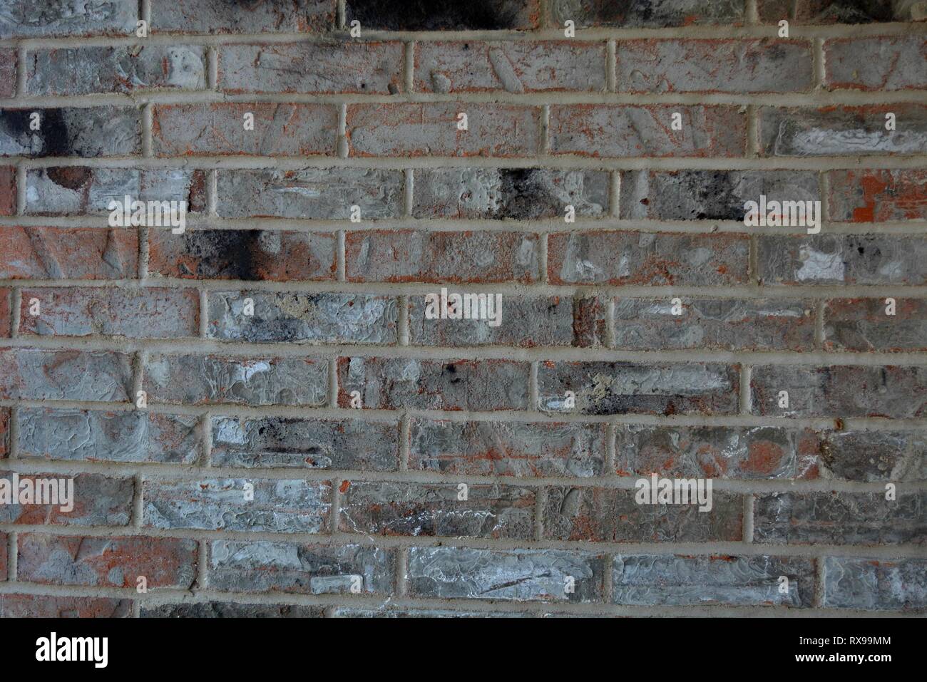 red, orange, grey, white, and black brick background wall Stock Photo