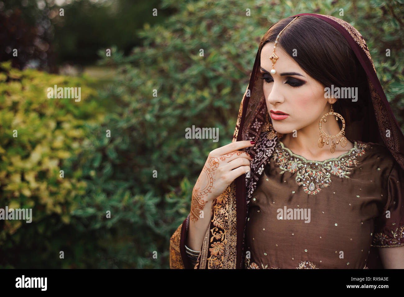 Mehendi On The Hands Of Girls Woman Hands With Brown Mehndi Tattoo Hands Of Indian Bride Girl