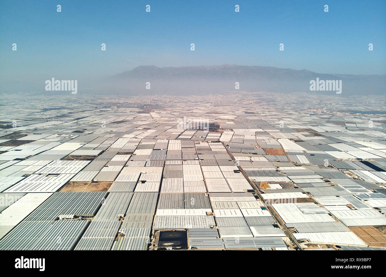 Aerial above drone point of view many polythene plastic exterior greenhouses hothouses where cultivated fruits and vegetables in the Almerimar, provin Stock Photo