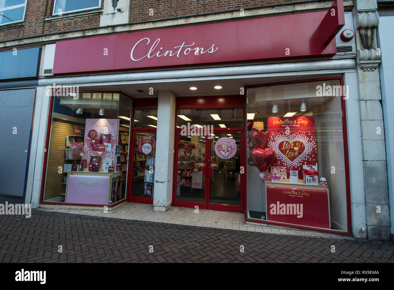 Northampton Clintons cards shop Valentines day store heart poster posters design designs outside front entrance signs balloons balloon love card shop Stock Photo