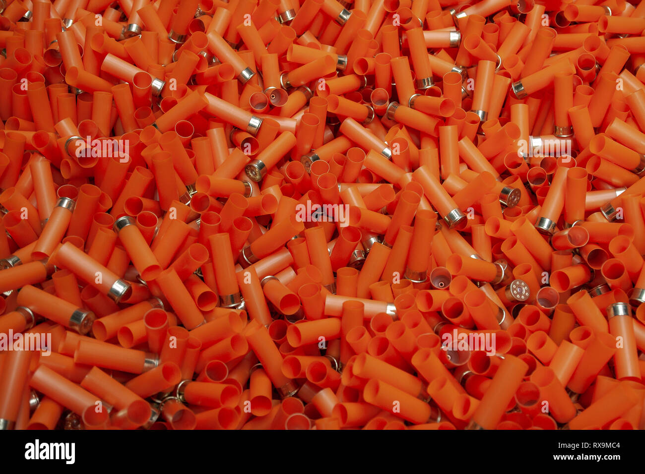 Empty orange shotgun cartridges Stock Photo