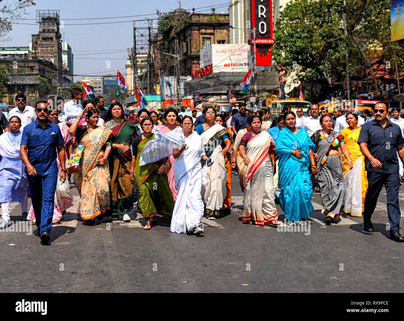 Chief Minister of West Bengal (Middle White Saree) Mamata Banerjee seen leading the rally during the International Women's Day in Kolkata. Stock Photo