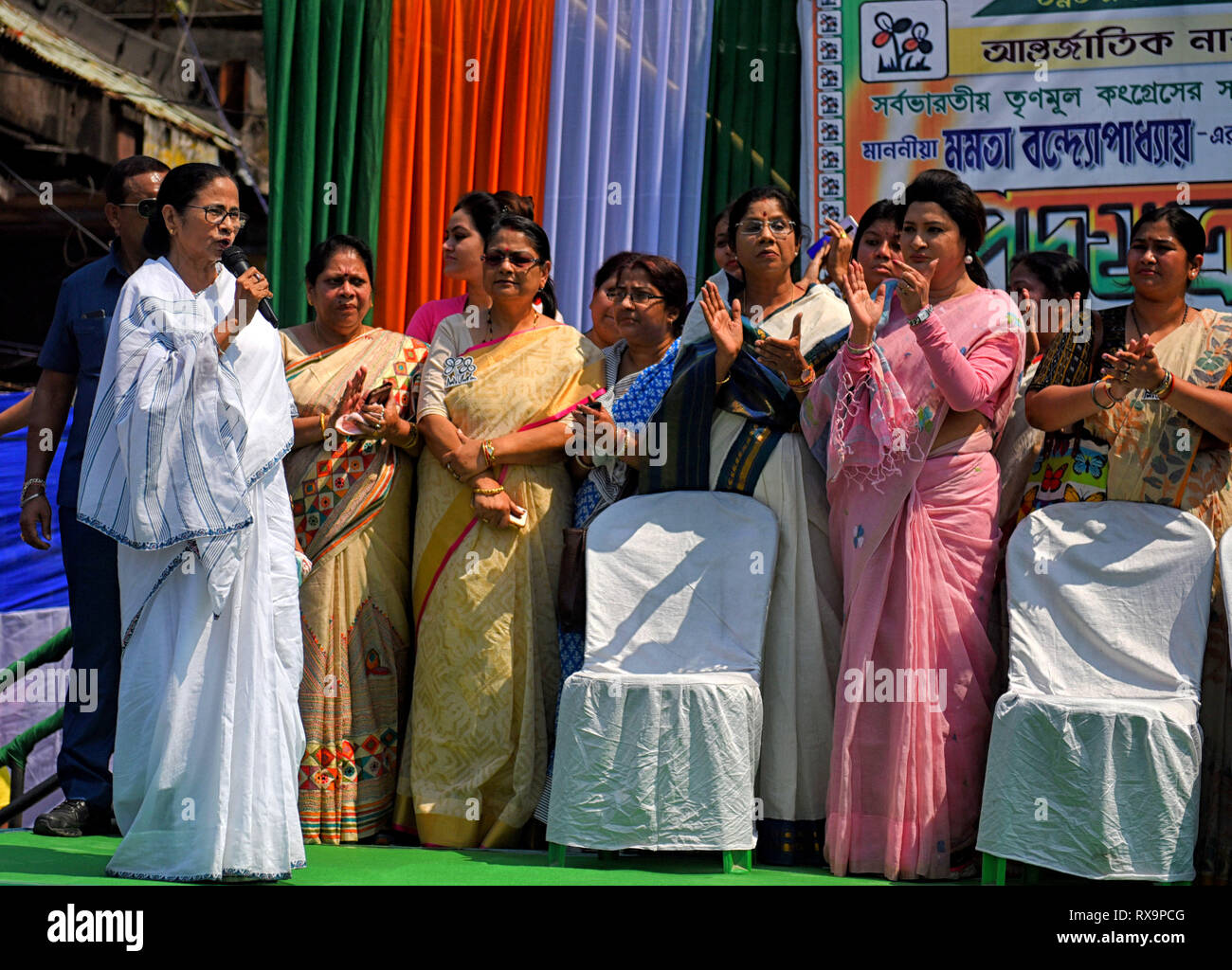 Chief Minister of West Bengal (Middle White Saree) Mamata Banerjee seen speaking during the rally on International Women's Day in Kolkata. Stock Photo