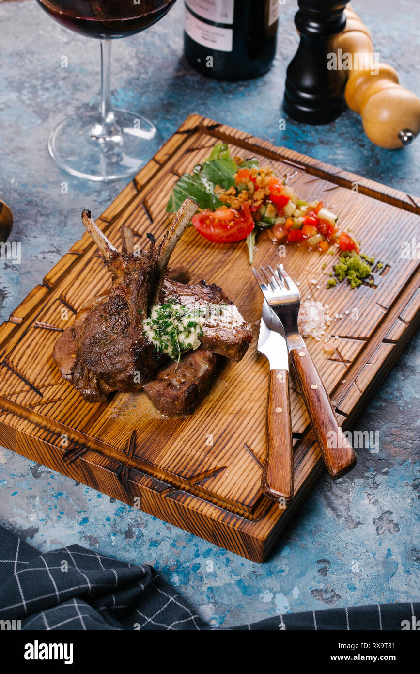 High angle view of grilled meat salad served on wooden board Stock Photo