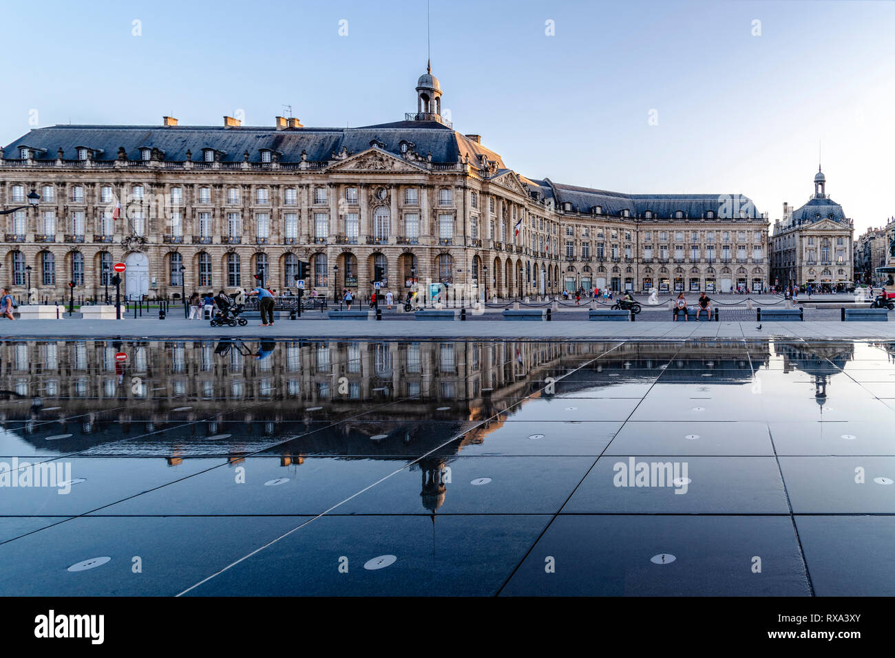 Palace reflecting in water mirror at city Stock Photo