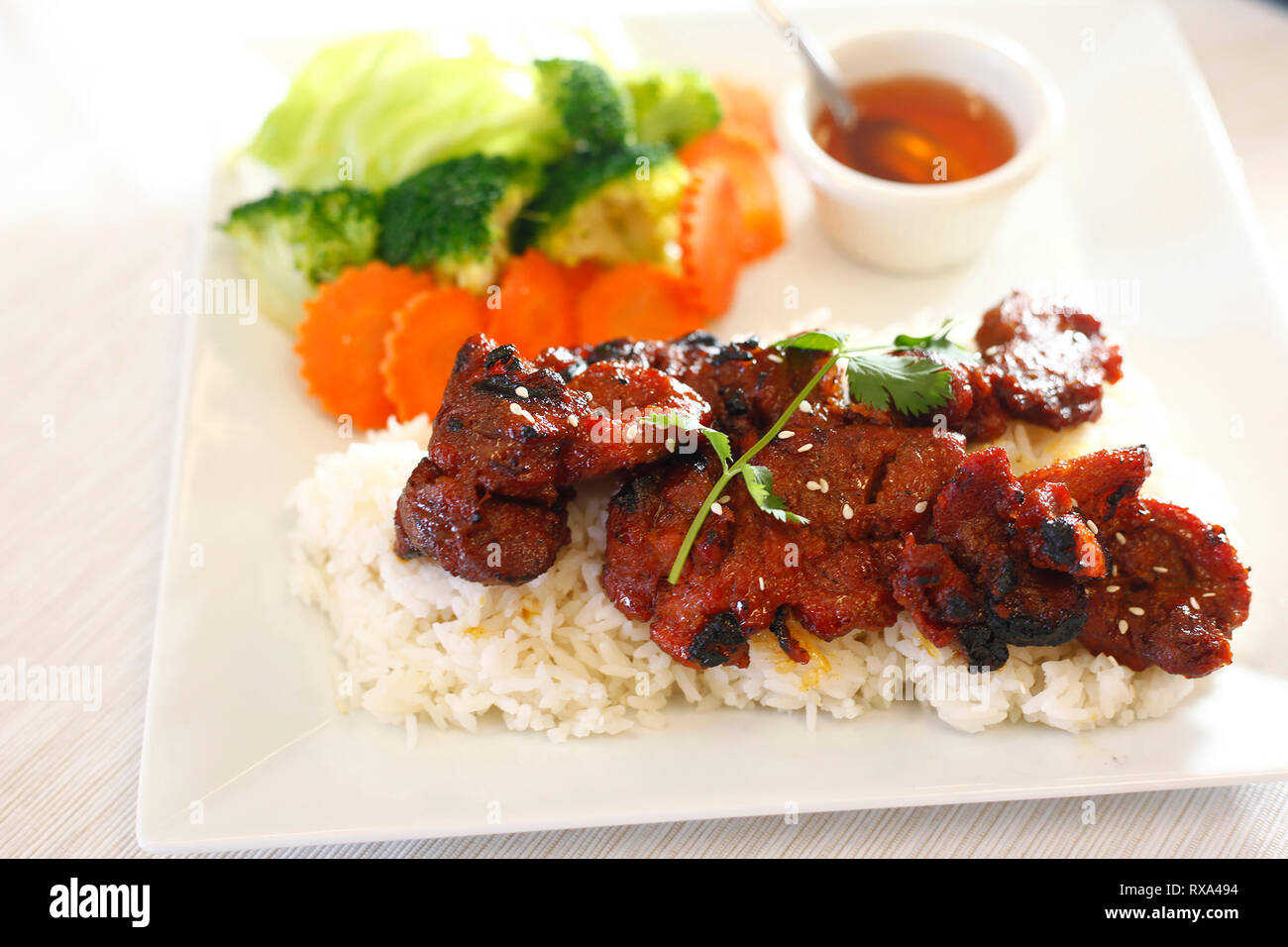 High angle view of rice with meat and salad served in plate on table Stock Photo