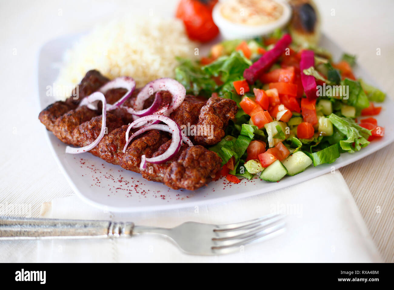 Close-up of meat with salad and rice served in plate on table Stock Photo