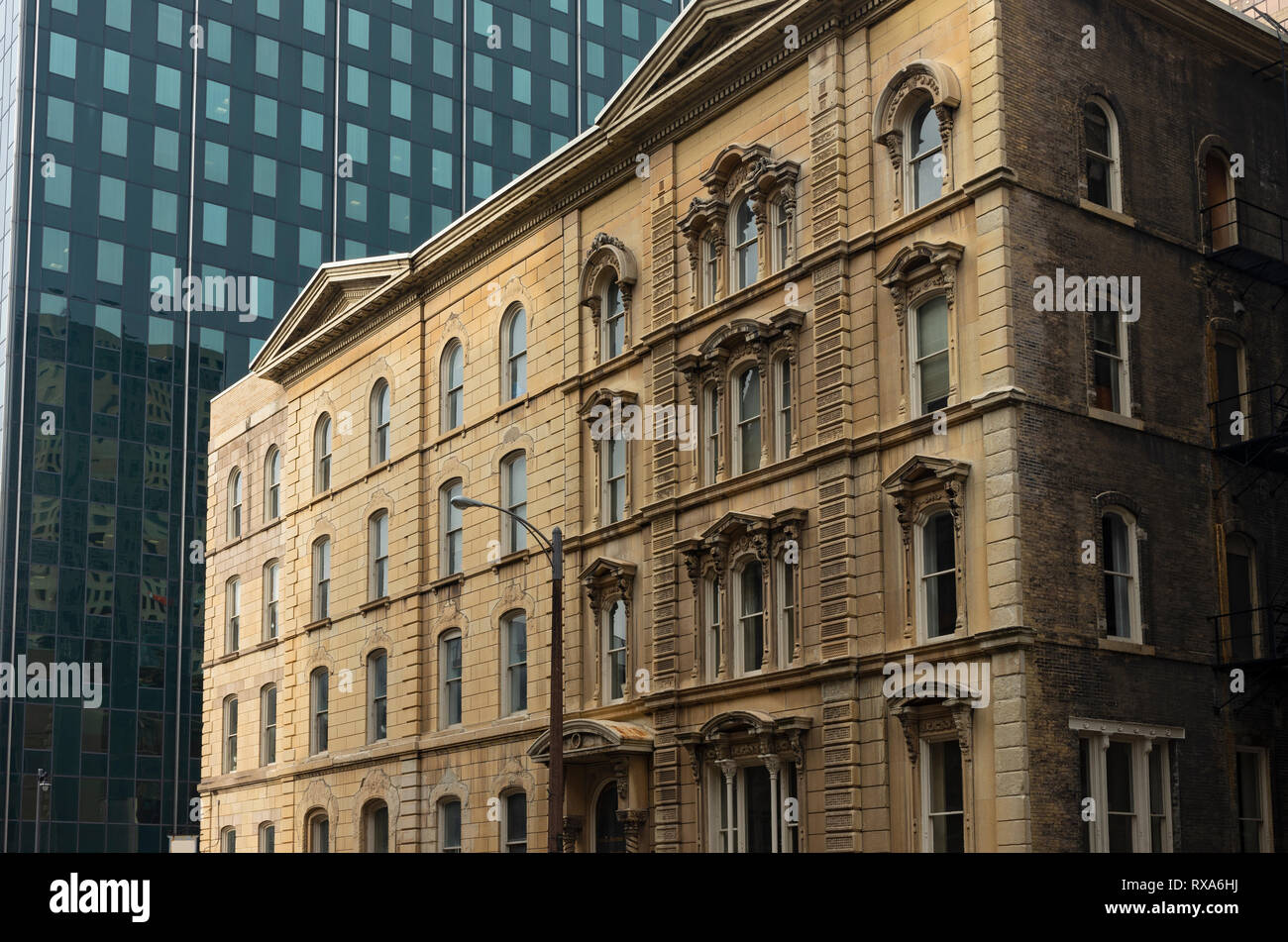 landmark building and glass office tower in commercial historic