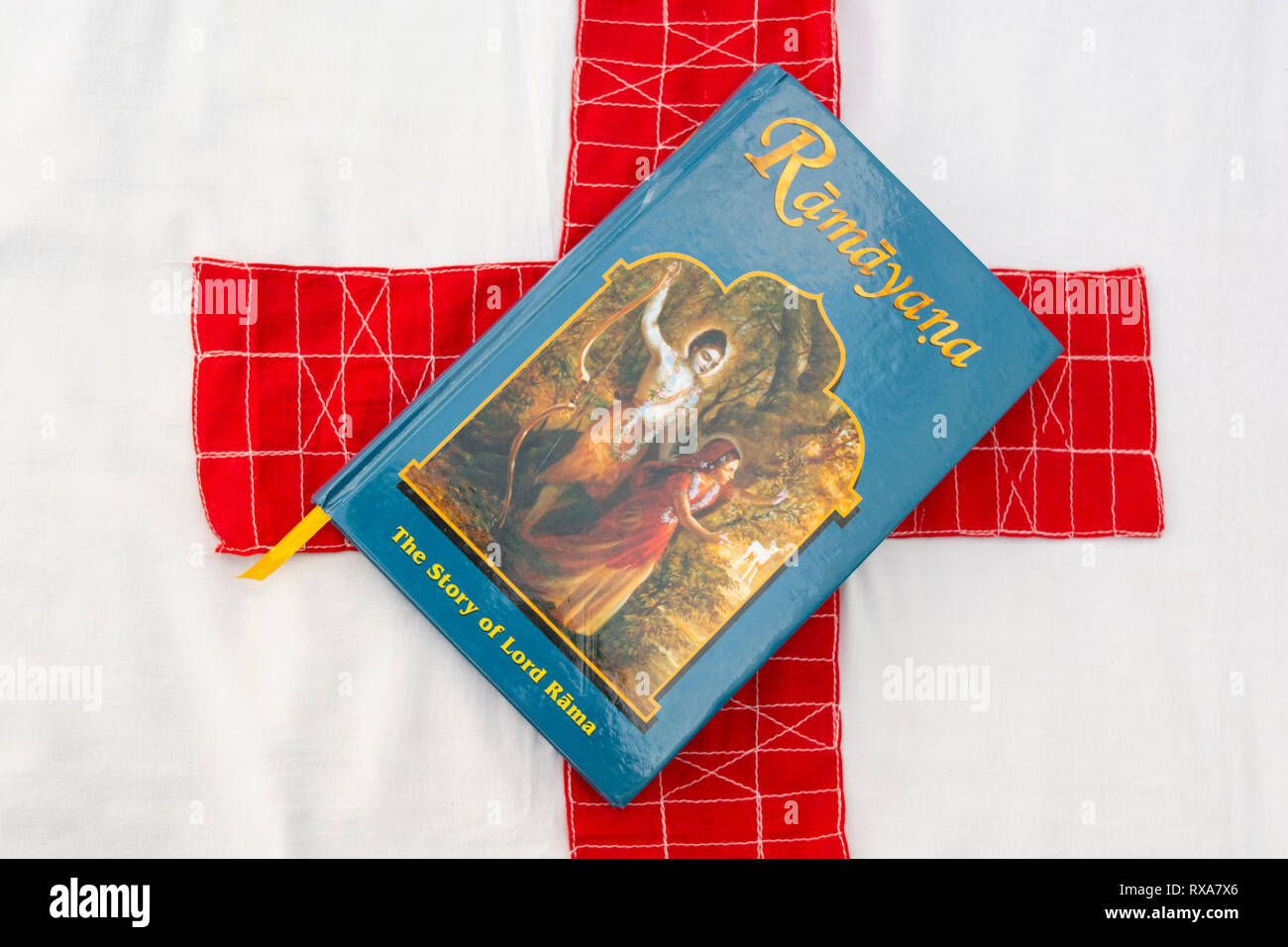 Maski,Karnataka,India - March 07,2019 : The Epic Hindu Mythology Ramayana book on isolated background with red cloth Stock Photo