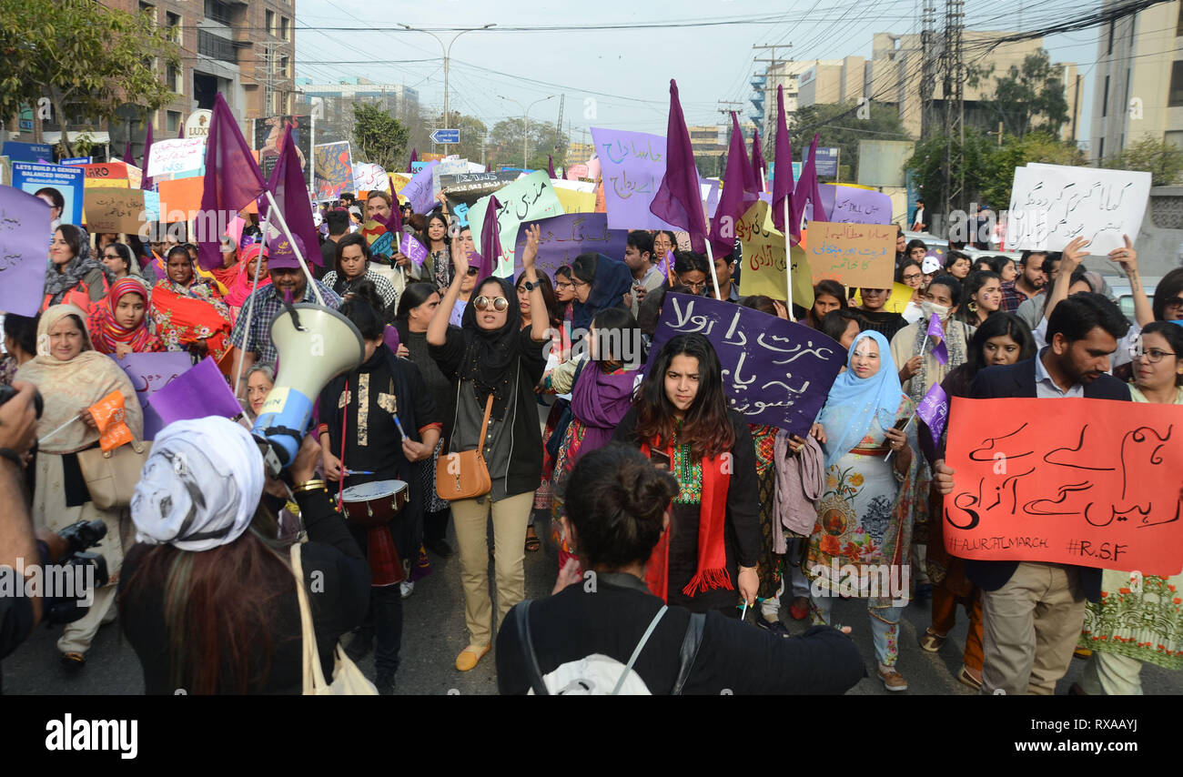 Lahore, Pakistan. 08th Mar, 2019. Women activists from different civil society hold placards during their protest rally from Press Club to Punjab Assembly in connection with International Women's Day. As World observed 8th March International Women Day globally. International Women's Day is marked on March 08 every year and is a global day celebrating the economic, political and social achievements of women past, present and future. Credit: Rana Sajid Hussain/Pacific Press/Alamy Live News Stock Photo