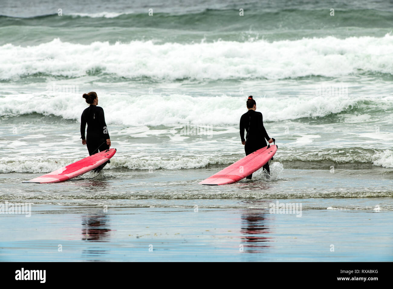 Surfers, Cox Bay, Tofino, BC, Canada Stock Photo