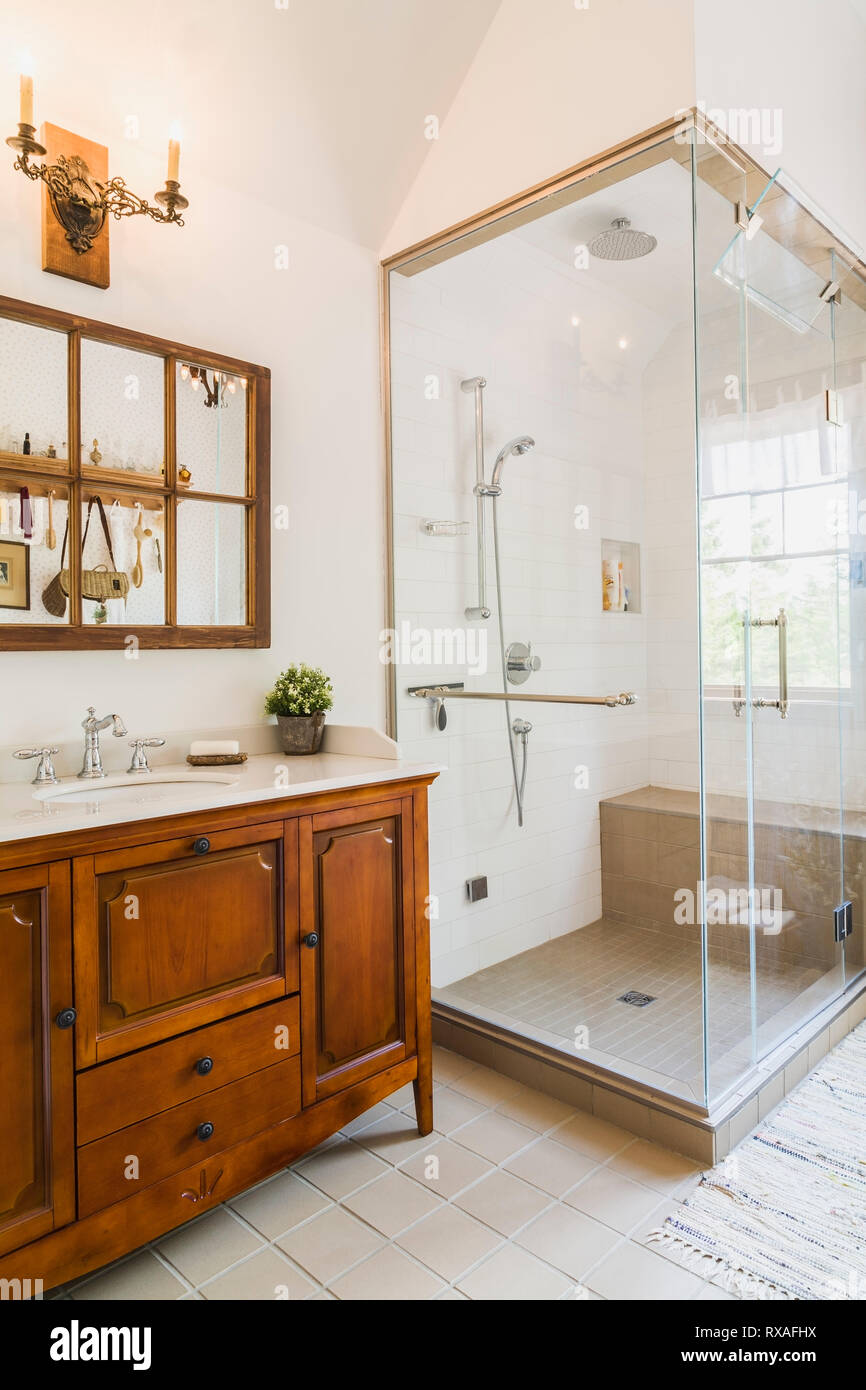 Antique Wooden Sink Cabinet With Quartz Countertop And Wall Mirror