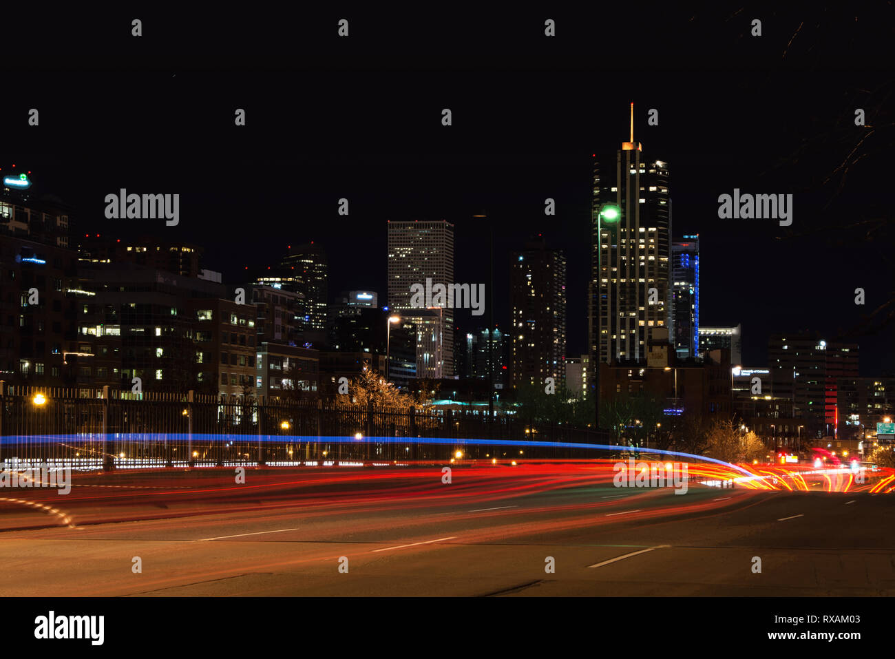 Beautiful downtown Denver skyline seen at night from Speer Blvd leading into town.  Exclusive image. Stock Photo