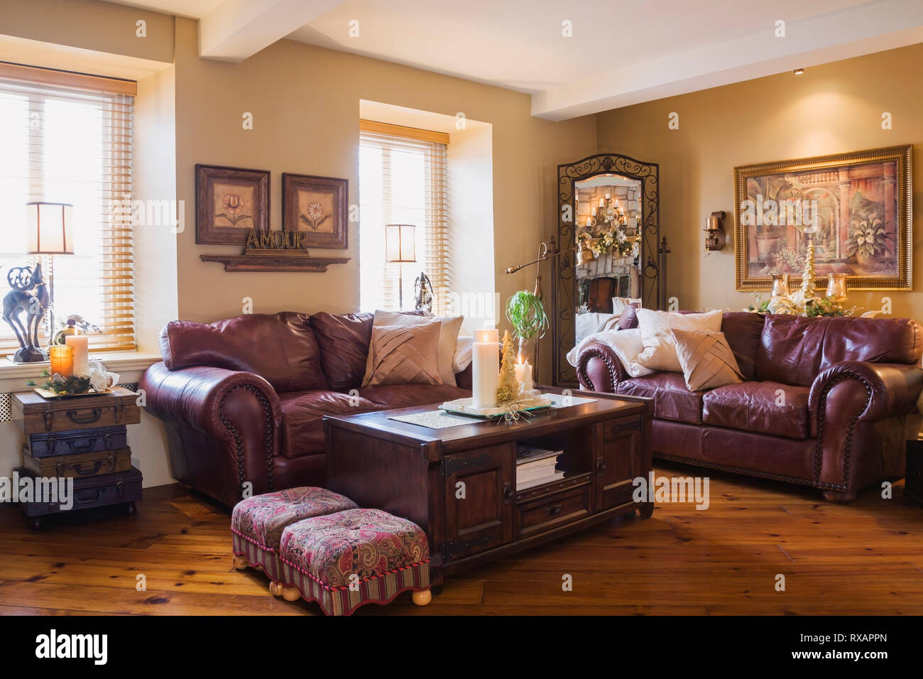 Burgundy Leather Sofas And Wooden Coffee Table In Living Room