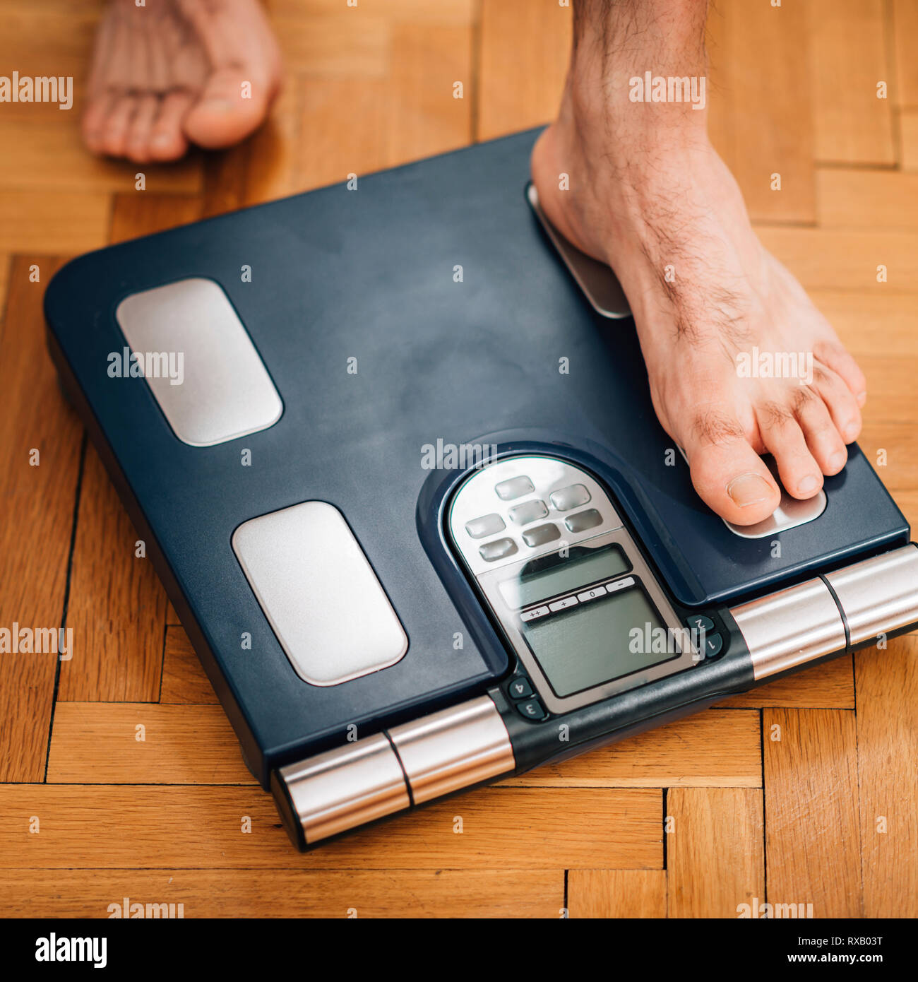 Measuring body weight Stock Photo Alamy