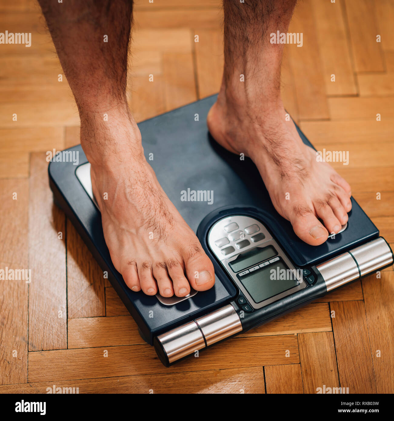 Measuring body weight Stock Photo Alamy