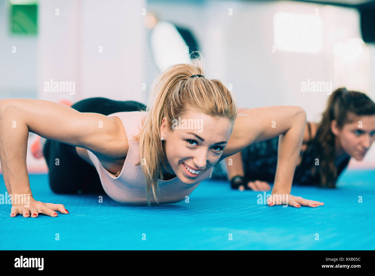 Woman doing push up Stock Photo