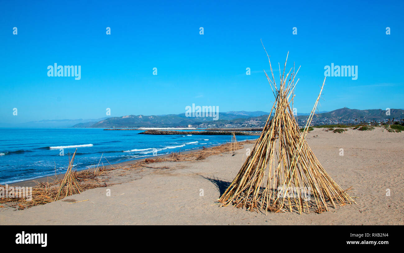 Bamboo teepee on Surfers Knoll beach at McGrath State Park in Ventura California United States Stock Photo
