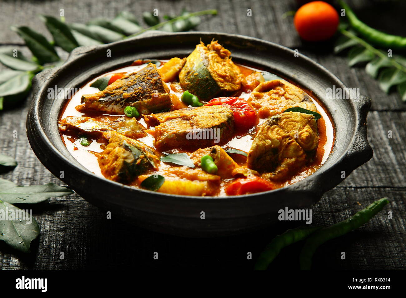 Fish curry cooked in clay pot Stock Photo Alamy