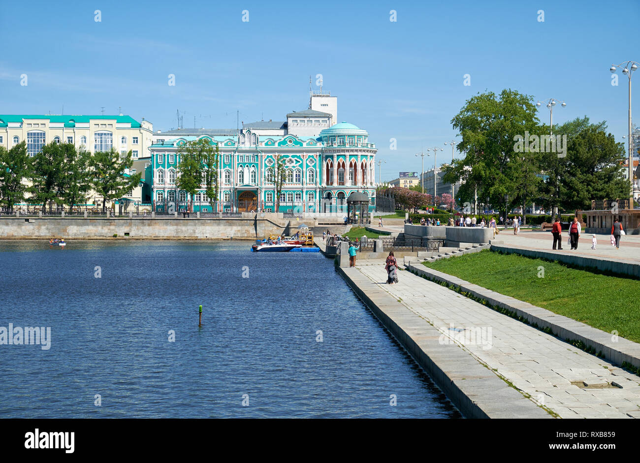 YEKATERINBURG, RUSSIA - MAY 26, 2015:   Iset river embankment on Lenin Prospekt with view on Home Sevastyanov and the administration building of the G Stock Photo