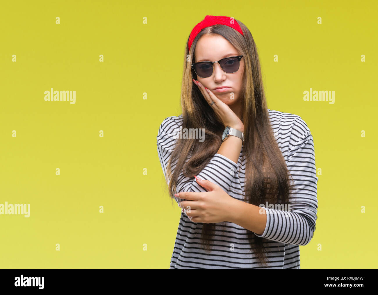 Young beautiful caucasian woman wearing sunglasses over isolated