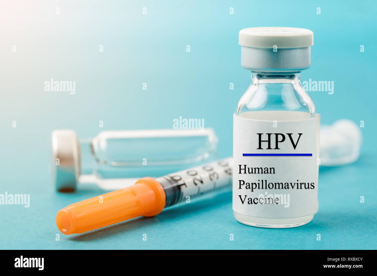 Human Papilloma Virus vaccine with syringe and vial n laboratory background. Stock Photo